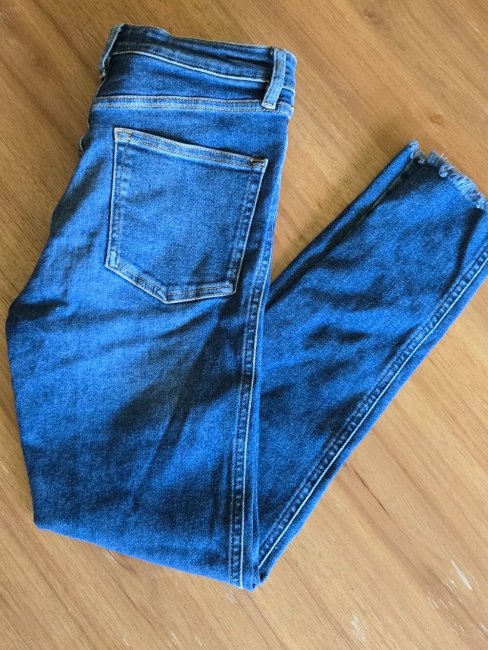 we the free medium wash raw hem skinny jeans | size 28